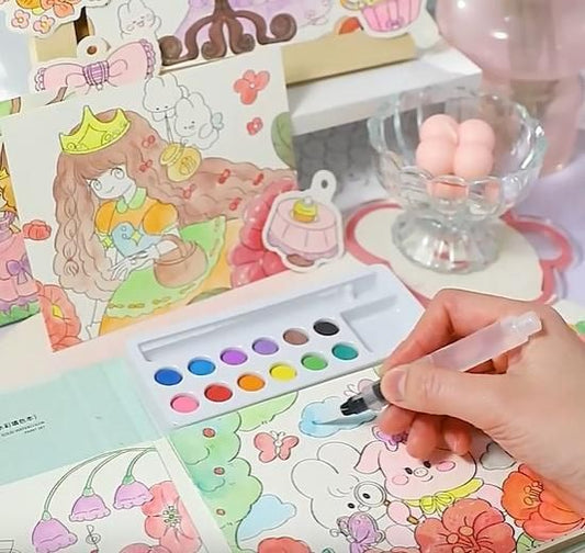 Hand painting colorful cartoon characters using a children's art painting kit with watercolor palette
