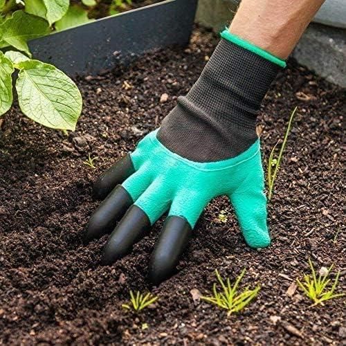 Hand wearing waterproof gardening gloves with claw fingertips digging soil in garden